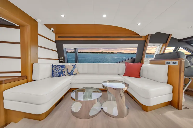 Slide: The Image of Luxurious 2011 Ferretti Yachts 660 interior with white seating and ocean view. - 19