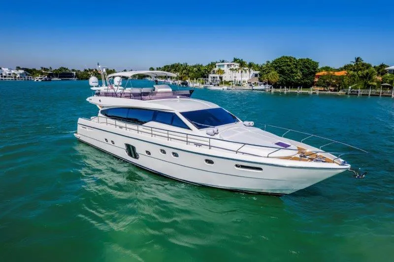 Slide: The Image of Luxurious 2011 Ferretti Yachts 660 cruising on turquoise waters under clear blue skies. - 2