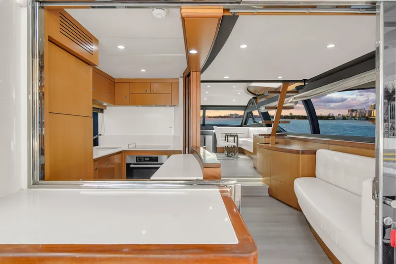 Slide: The Image of Luxurious interior of 2011 Ferretti Yachts 660 with modern kitchen and seating area. - 21