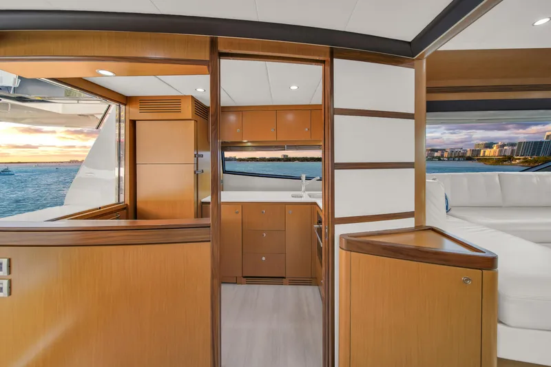 Slide: The Image of Luxurious interior of 2011 Ferretti Yachts 660 with wood finishes and ocean view. - 24