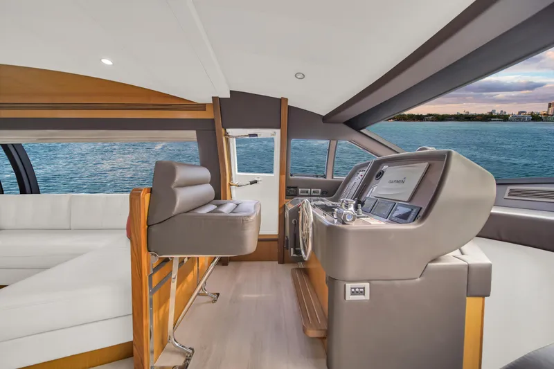 Slide: The Image of Interior of 2011 Ferretti Yachts 660, featuring modern helm and luxurious seating. - 29