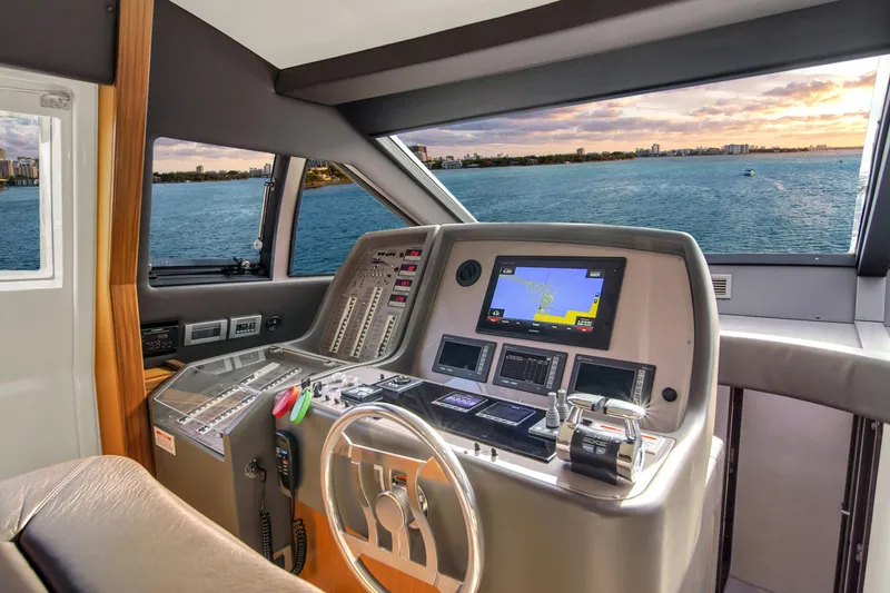 Slide: The Image of Ferretti Yachts 660 helm, 2011 model, with navigation equipment and ocean view. - 31