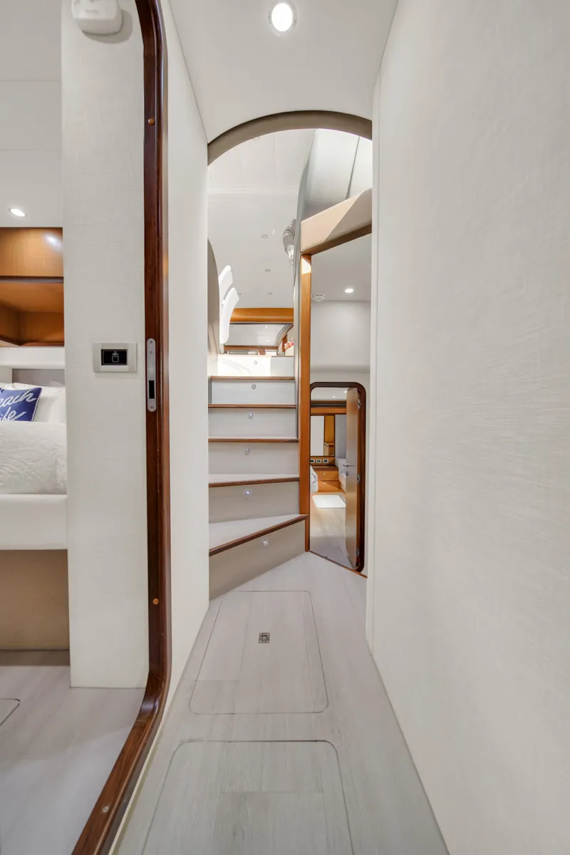 Slide: The Image of Interior hallway of 2011 Ferretti Yachts 660, featuring modern design and wooden accents. - 32