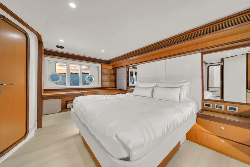 Slide: The Image of Luxurious bedroom interior of 2011 Ferretti Yachts 660 with elegant wood finishes. - 33