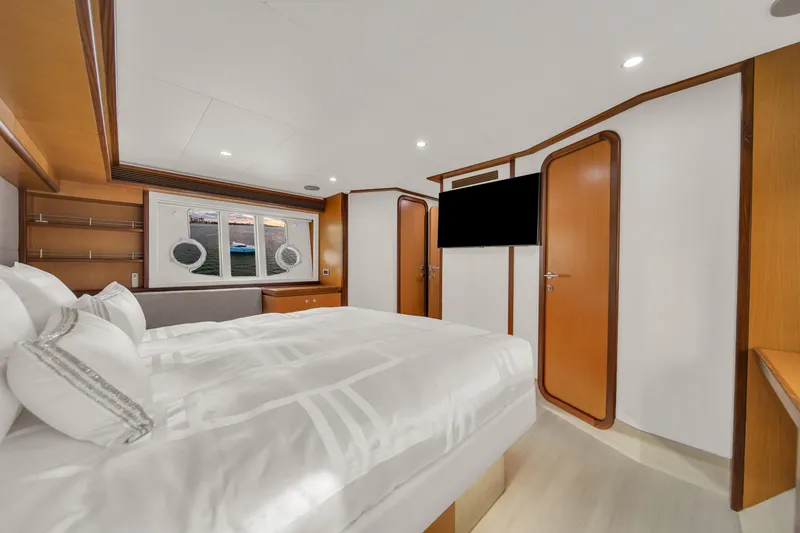 Slide: The Image of Luxurious bedroom interior of 2011 Ferretti Yachts 660 with modern design and elegant furnishings. - 36