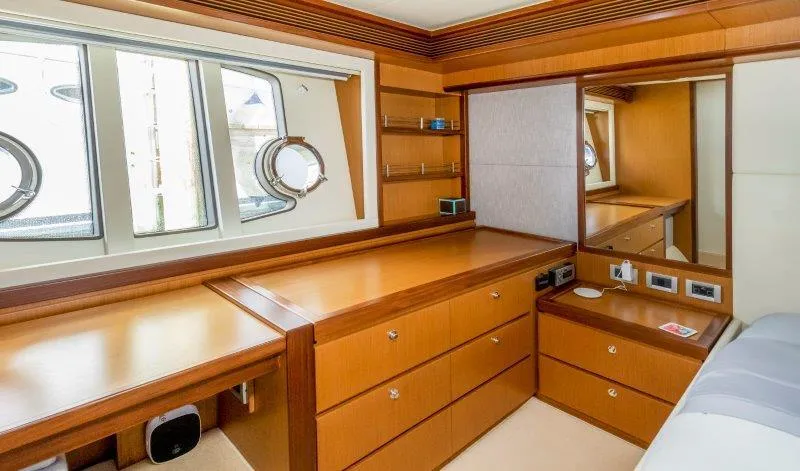Slide: The Image of Luxurious Ferretti Yachts 660 cabin interior with wooden cabinetry and porthole windows, 2011 model. - 37