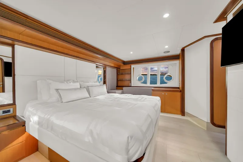 Slide: The Image of Luxurious bedroom interior of 2011 Ferretti Yachts 660 with elegant wood accents and ocean view. - 38