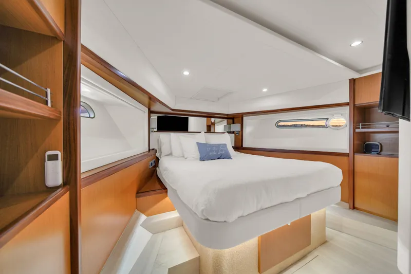 Slide: The Image of Luxurious bedroom interior of 2011 Ferretti Yachts 660 with modern design and cozy ambiance. - 40