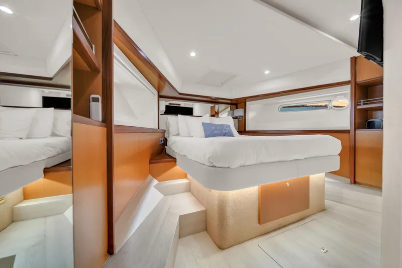 Slide: The Image of Luxurious bedroom interior of 2011 Ferretti Yachts 660 with modern design and ambient lighting. - 41