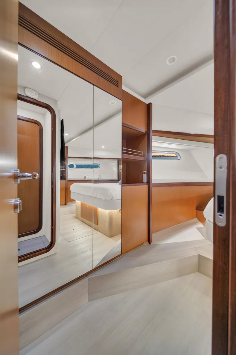 Slide: The Image of Luxurious interior of 2011 Ferretti Yachts 660, featuring elegant wood finishes and modern design. - 42