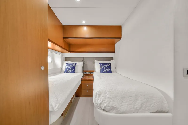 Slide: The Image of Luxurious twin cabin in 2011 Ferretti Yachts 660, featuring modern wood accents. - 47