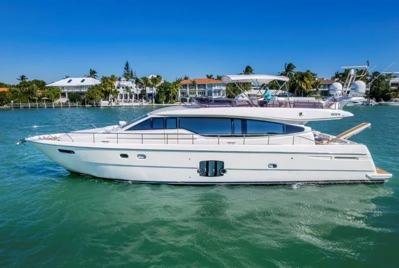 Slide: The Image of 2011 Ferretti Yachts 660 cruising on a sunny day near waterfront homes. - 7