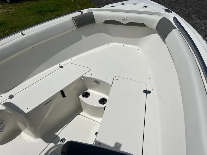 Slide: The Image of 2021 Sailfish 242 CC boat interior with seating and storage compartments. - 10