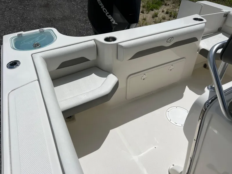 Slide: The Image of 2021 Sailfish 242 CC boat interior with seating and storage compartments. - 15