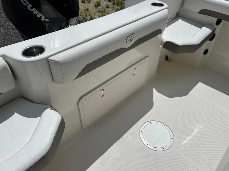 Slide: The Image of 2021 Sailfish 242 CC boat interior with seating and storage compartment. - 25
