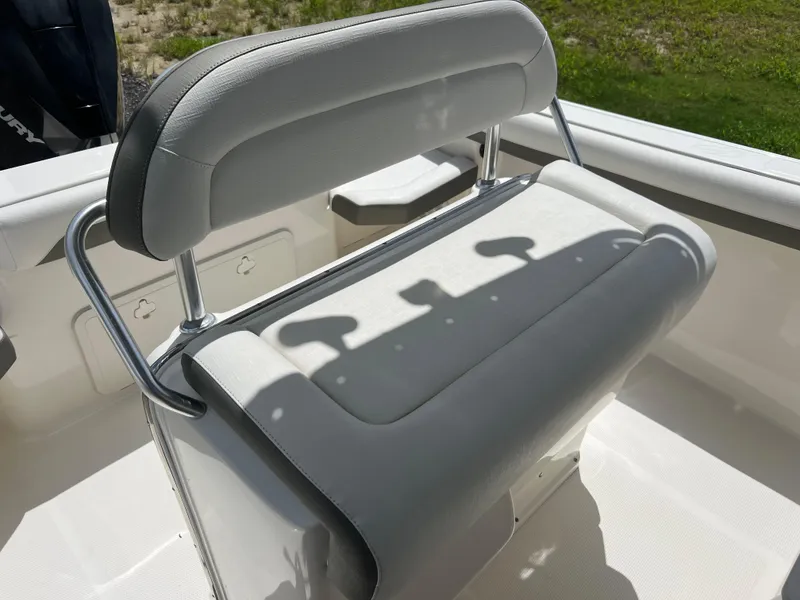Slide: The Image of 2021 Sailfish 242 CC boat seat with cushioned backrest and metal frame. - 26