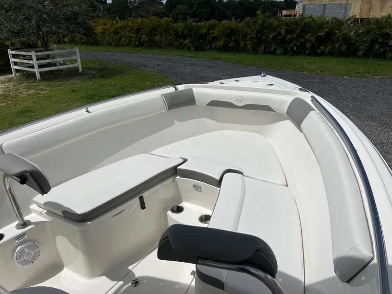 Slide: The Image of 2021 Sailfish 242 CC boat interior with white seating and table. - 8