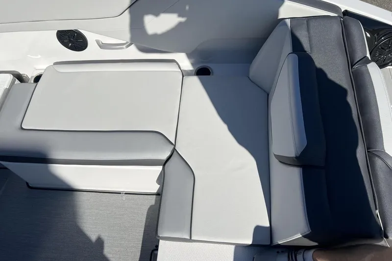 Slide: The Image of 2025 Yamaha Boats AR250 interior seating with sleek, modern design and comfortable upholstery. - 13