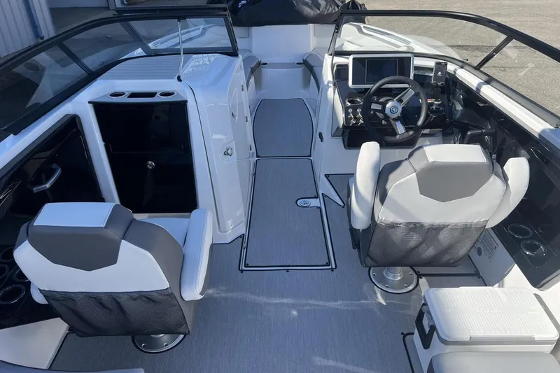 Slide: The Image of 2025 Yamaha Boats AR250 interior with modern helm and seating. - 14