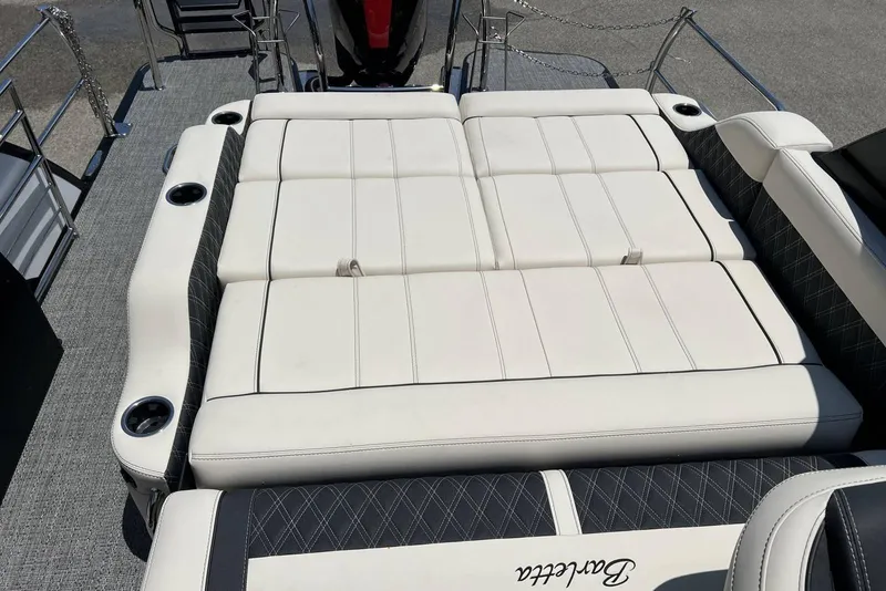 Slide: The Image of 2026 Barletta L25UCA boat with luxurious white seating and cup holders. - 9