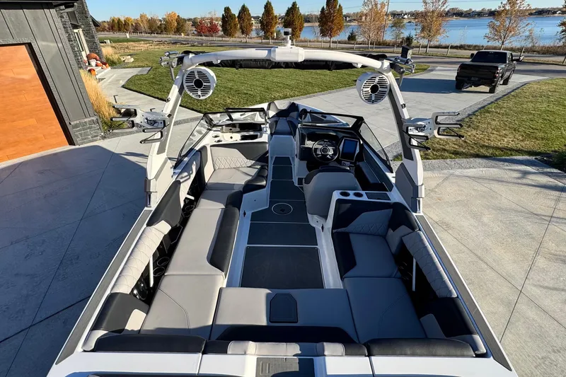 Slide: The Image of 2021 Tigé Z3 boat interior with modern seating and advanced dashboard features. - 11