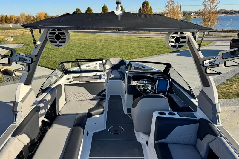 Slide: The Image of 2021 Tigé Z3 boat interior with modern dashboard and spacious seating. - 12