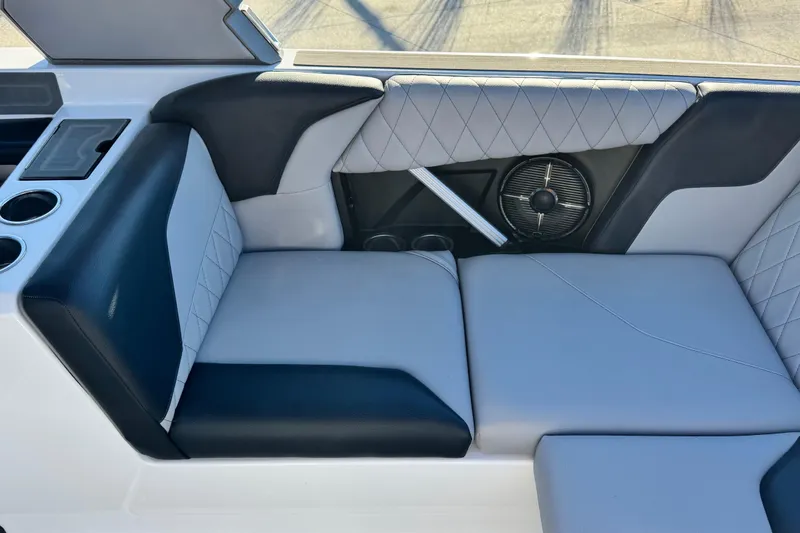 Slide: The Image of 2021 Tigé Z3 boat interior with black and white seating, cup holders, and speaker. - 14