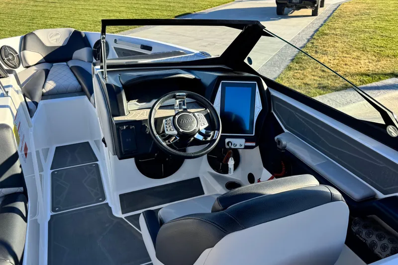 Slide: The Image of 2021 Tigé Z3 boat interior with modern dashboard and steering wheel. - 16