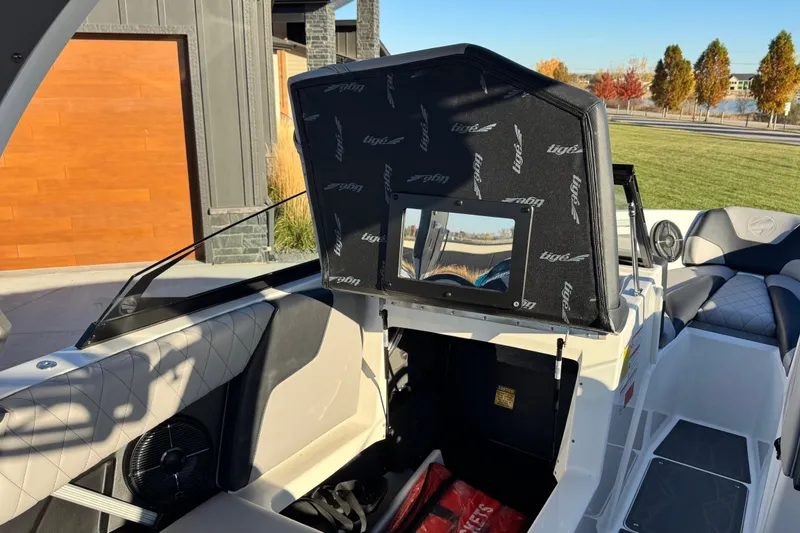 Slide: The Image of 2021 Tigé Z3 boat interior with open storage compartment, showcasing sleek design and seating. - 22