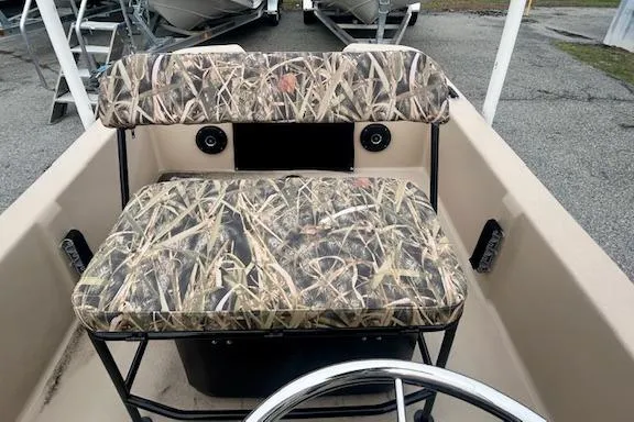 Slide: The Image of 2026 Carolina Skiff E20 JVX CC boat interior with camo-patterned seating. - 5