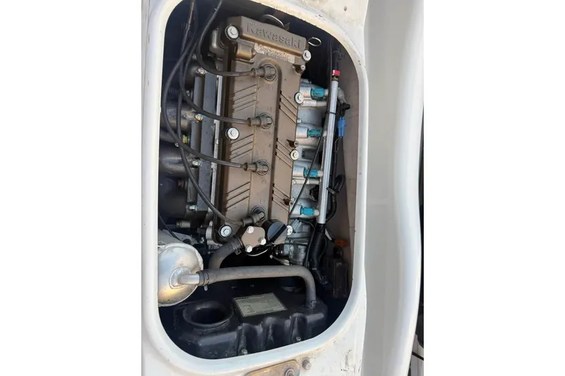 Slide: The Image of 2013 Kawasaki STX15F engine compartment, showcasing internal components and wiring. - 5