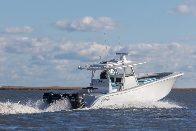 Slide: The Image of 2018 Yellowfin 39 Offshore boat cruising on open water under a clear sky. - 28