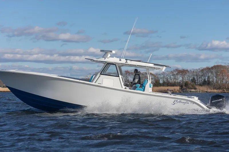 Slide: The Image of 2018 Yellowfin 39 Offshore boat cruising on water under a clear sky. - 46