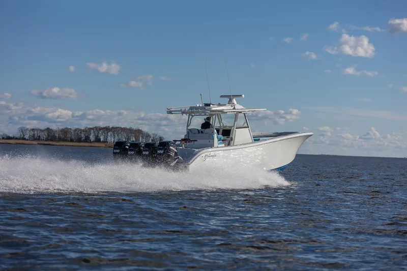 Slide: The Image of 2018 Yellowfin 39 Offshore boat cruising on open water under a clear blue sky. - 5