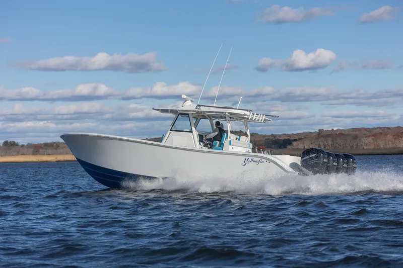 Slide: The Image of 2018 Yellowfin 39 Offshore boat cruising on open water under a clear sky. - 51