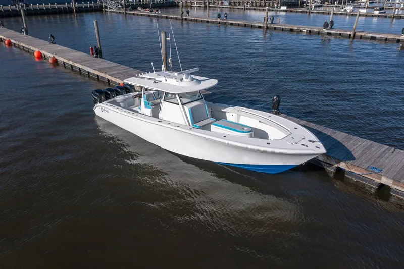 Slide: The Image of 2018 Yellowfin 39 Offshore boat docked at marina, side view. - 65