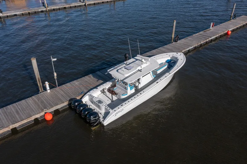 Slide: The Image of 2018 Yellowfin 39 Offshore boat docked on calm water. - 66