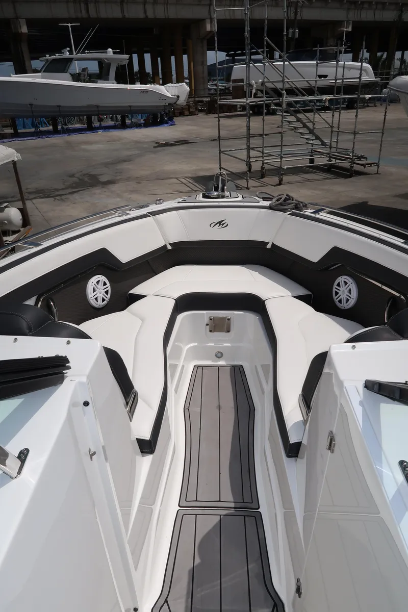 Slide: The Image of 2022 Monterey 275 Super Sport boat interior with sleek seating and modern design. - 17