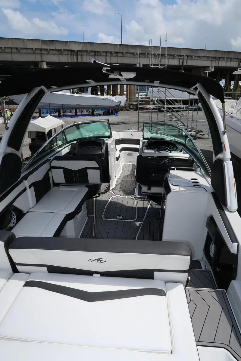 Slide: The Image of 2022 Monterey 275 Super Sport boat interior with sleek seating and modern design. - 19