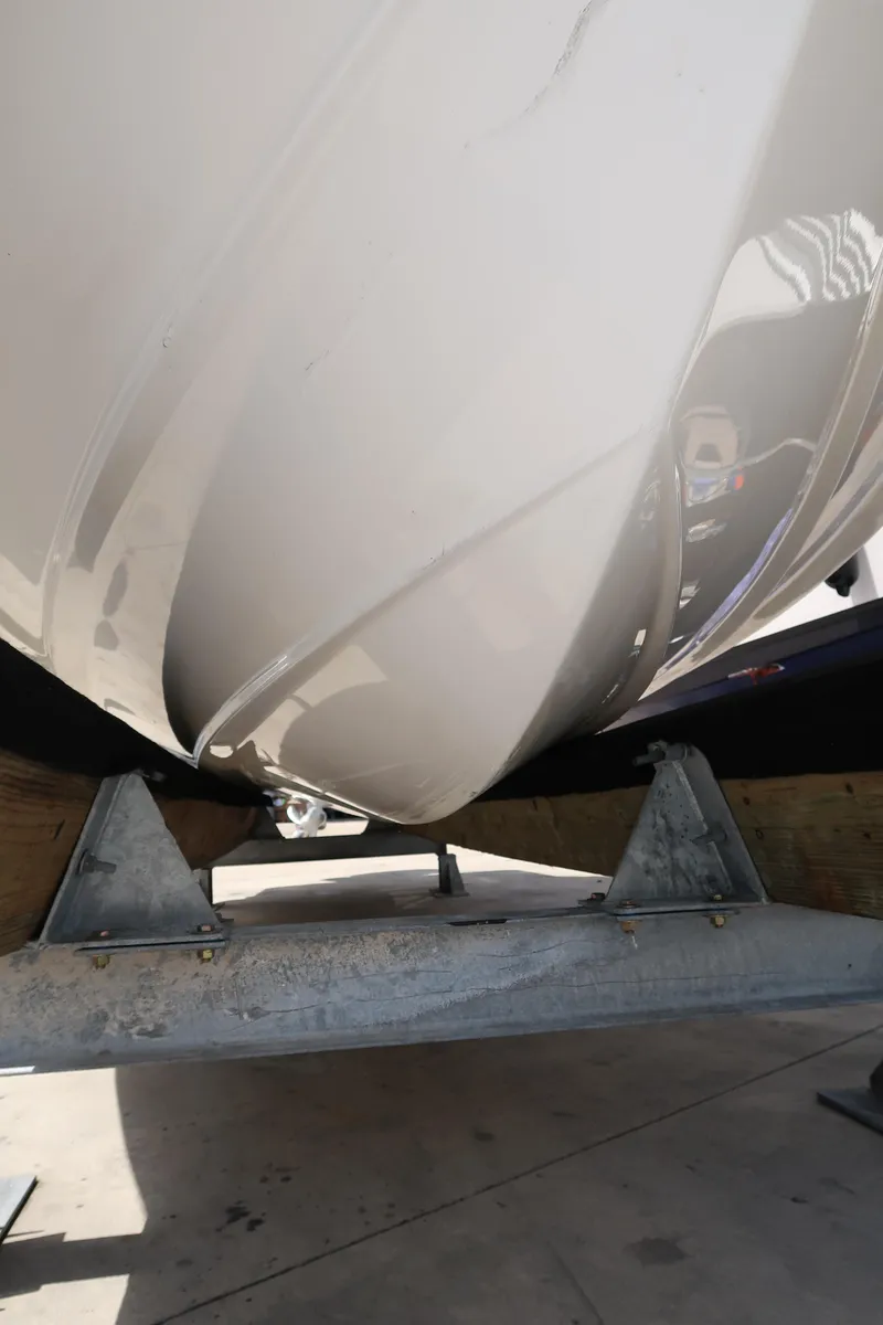 Slide: The Image of 2022 Monterey 275 Super Sport boat hull on trailer, close-up view. - 25