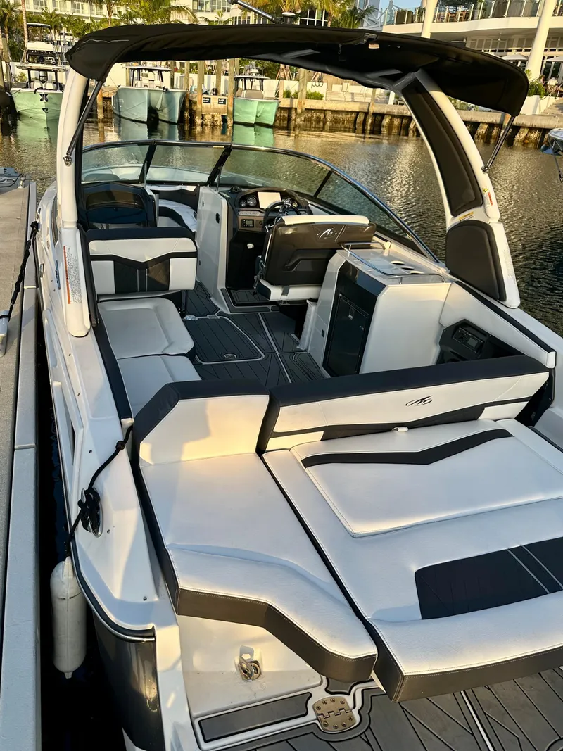Slide: The Image of 2022 Monterey 275 Super Sport boat docked by the water. - 4