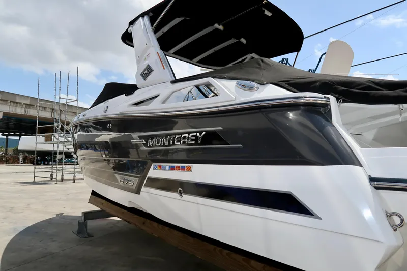 Slide: The Image of 2022 Monterey 275 Super Sport boat docked, showcasing sleek design and modern features. - 5