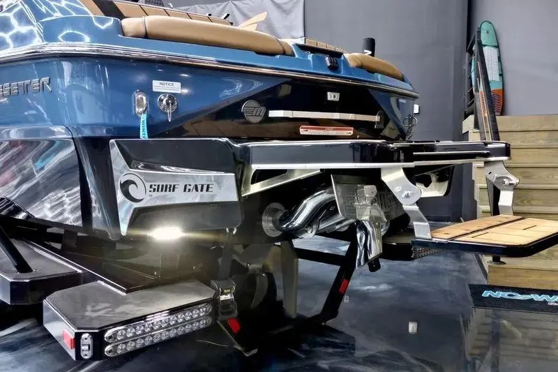 Slide: The Image of 2024 Malibu Wakesetter 24 MXZ boat with Surf Gate technology, rear view. - 13