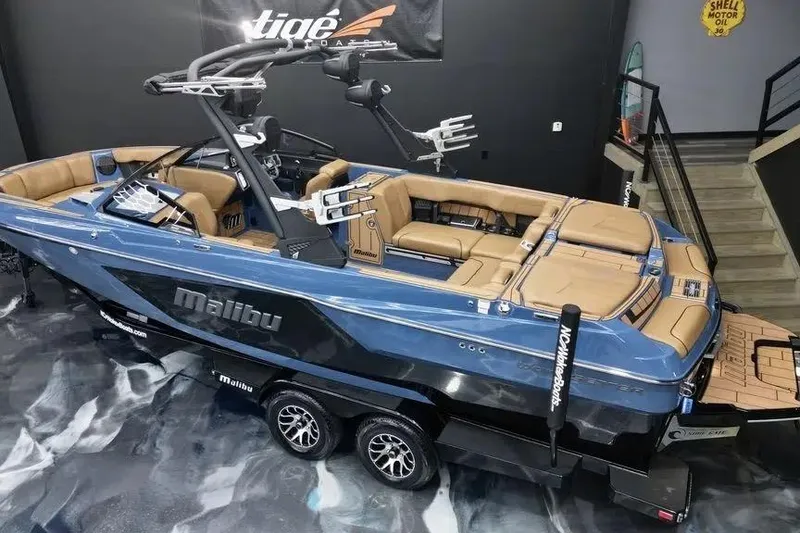 Slide: The Image of 2024 Malibu Wakesetter 24 MXZ boat with sleek design and luxurious interior. - 4