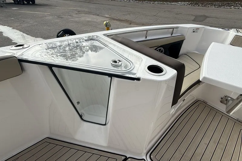 Slide: The Image of 2024 Yamaha Boats 255 FSH Sport E interior with seating and storage features. - 23