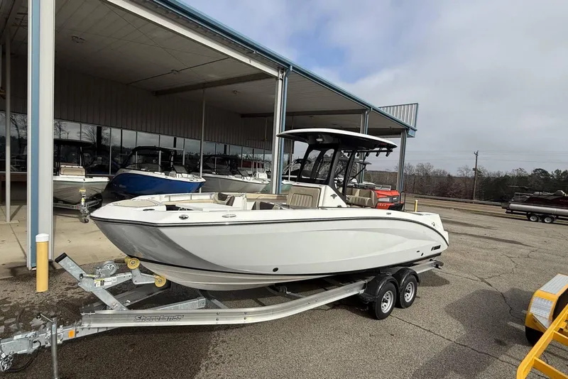 Slide: The Image of 2024 Yamaha Boats 255 FSH Sport E on trailer at dealership. - 7