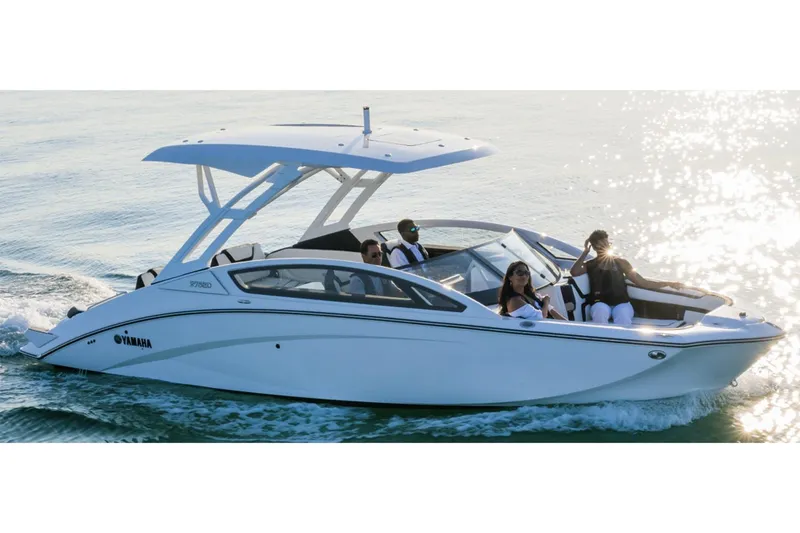 Slide: The Image of Manufacturer Provided Image: 2024 Yamaha Boats 275SD cruising on water with passengers enjoying the ride. - 1