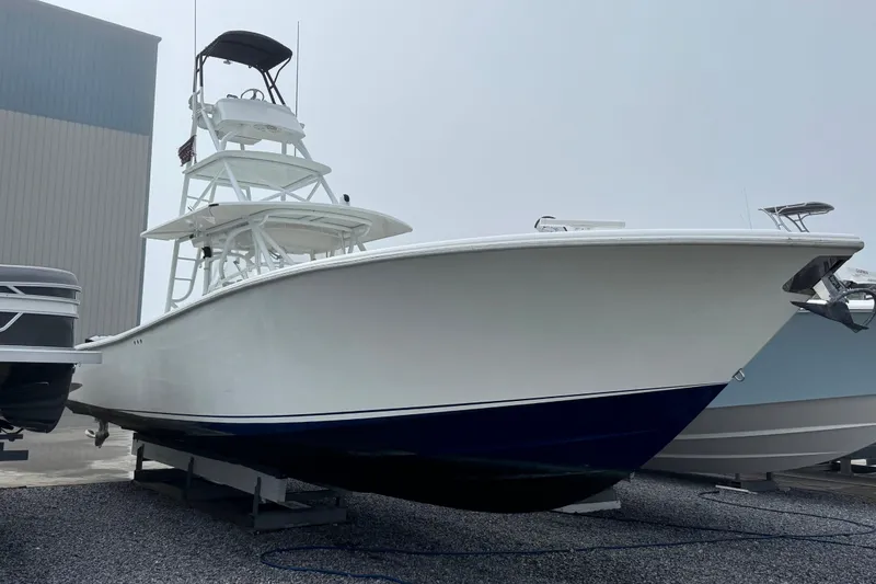 The Image of 2011 Yellowfin 42 Offshore boat on display, white hull with blue bottom. - 1