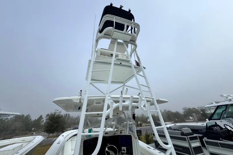Slide: The Image of 2011 Yellowfin 42 Offshore boat with a tall observation tower and control station. - 19