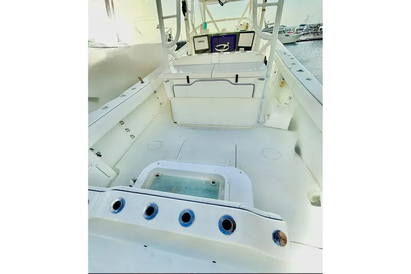Slide: The Image of 2011 Yellowfin 42 Offshore boat interior with spacious deck and control panel. - 22